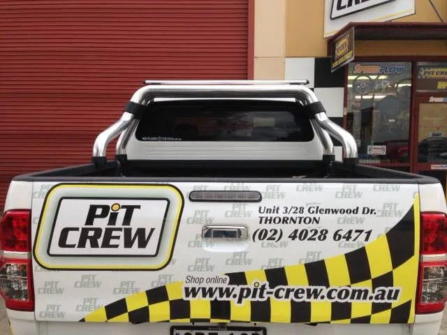 Rear of the Pit Crew signwritten vehicle