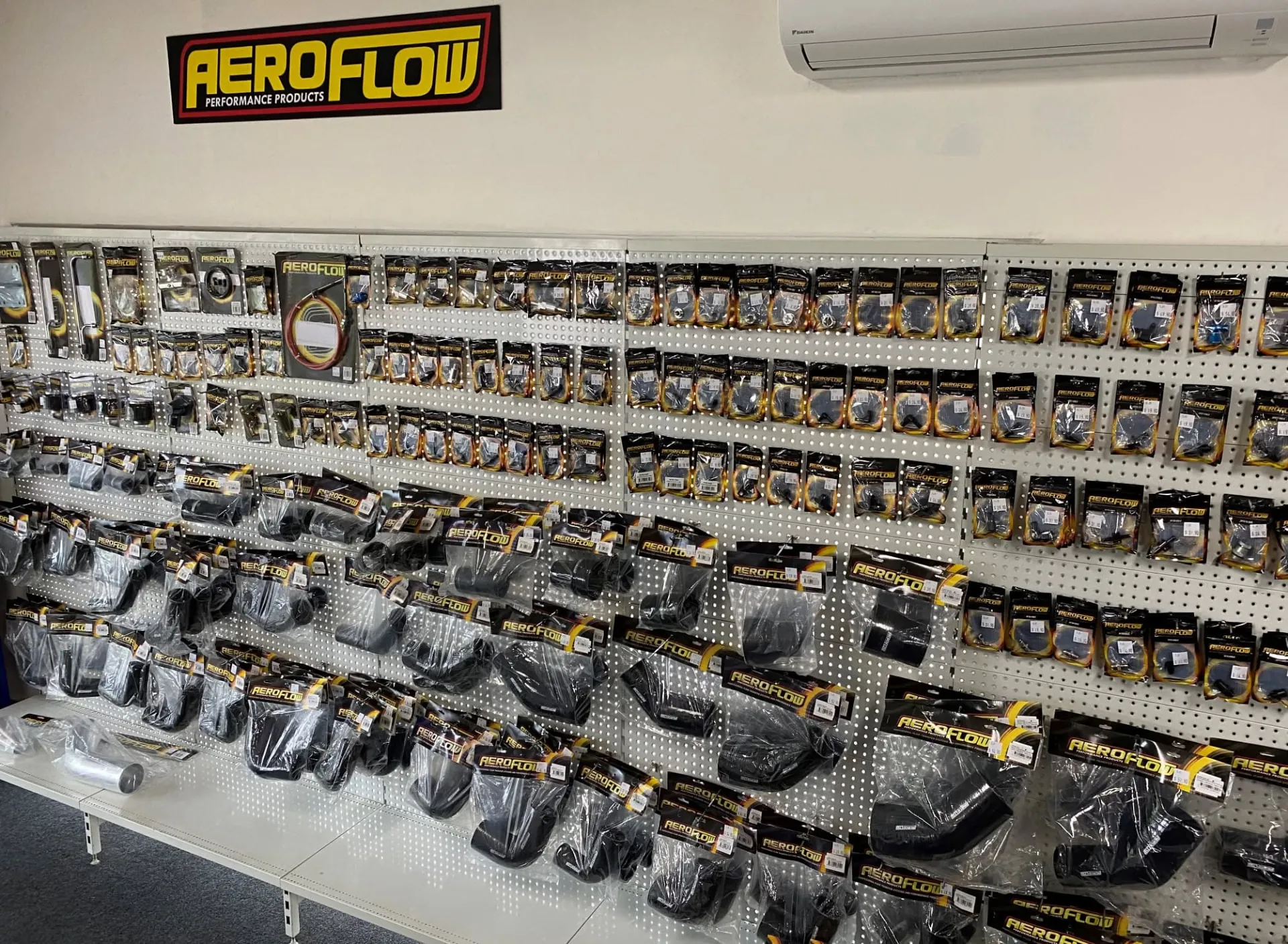 Aeroflow performance products wall display at Pit Crew in Thornton